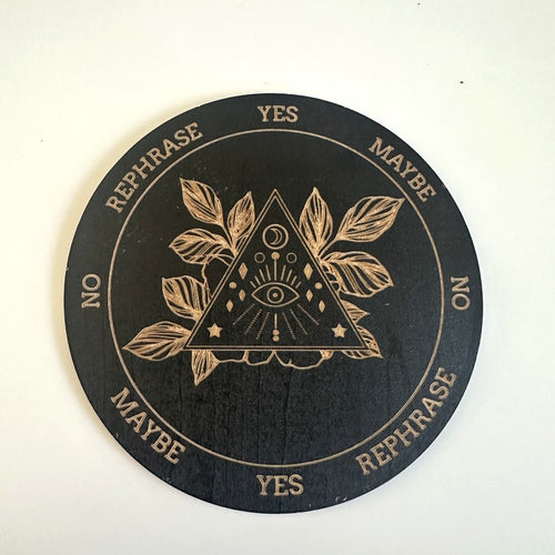 Black pendulum board with eye and leaves