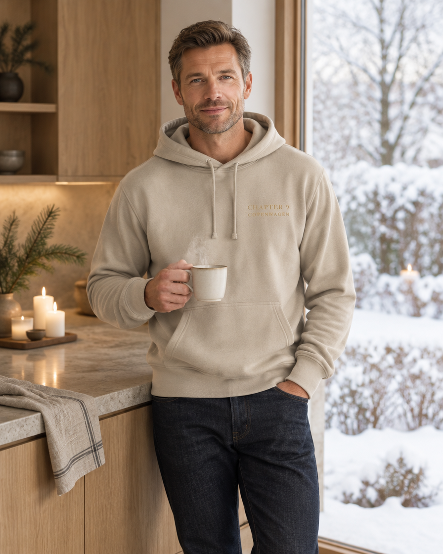 Man with coffee by a snowy window in the sand Chapter 9 Copenhagen lounge hoodie